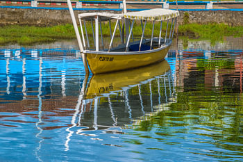 Fishing boat moored on the banks of the Rio das Almas in the town of Taperoa, Bahia Brazil
