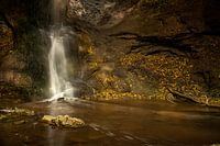 Mystical waterfall in autumn