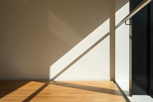 Abstract lines of shadow, railing and floor