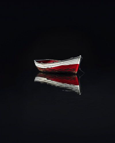 Small boat reflected in the water