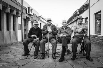 Four gentlemen on the lie bench, Puerto Marin, Spain