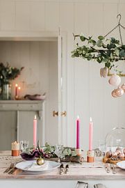 Pink Christmas lights above the table by Nienke van Denderen
