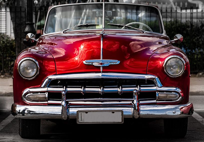 red vintage convertible car in street of old town of Havana Cuba by Dieter Walther