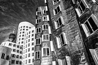 Gehry buildings in the media harbour in Düsseldorf with Rhine tower in black and white