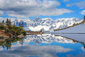 Winter reflection in the mirror lake on the Reiteralm by Christa Kramer