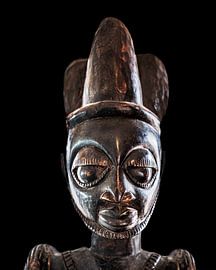 African carving statue with dark background