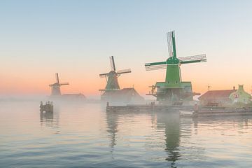Windmills in morning fog at Zaanse Schans by Pieter Struiksma