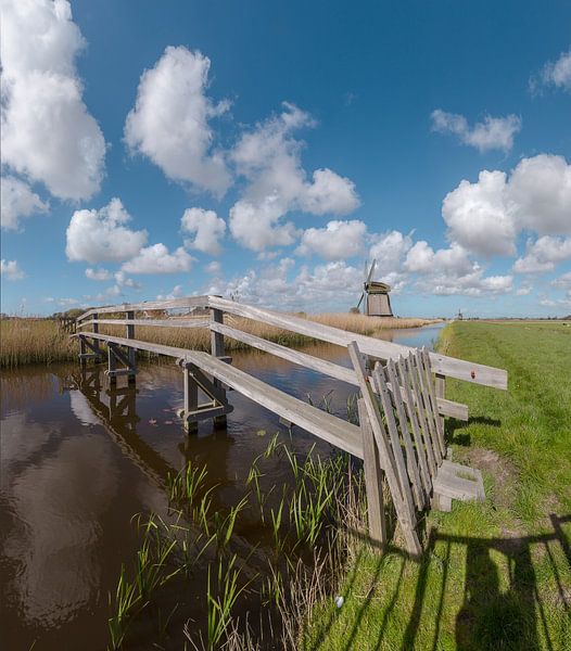 Footbridge over a canal with windmills, ‘t Zand, Noord-Holland, , Netherlands by Rene van der Meer