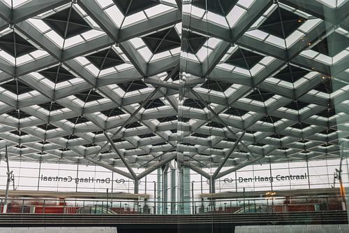 Tram and reflection on central station The Hague