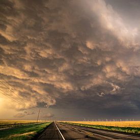 Stormclouds crossing the road by Menno van der Haven