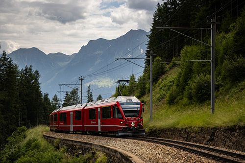 Swiss Rhatische Bahn train in mountain scenery by Arthur Scheltes
