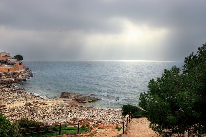 The sun breaks through the clouds in Moraira by Erik Groen