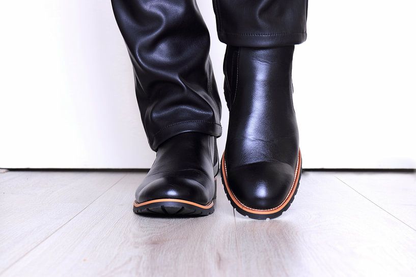 Leather men's shoes on the floor by Bobsphotography