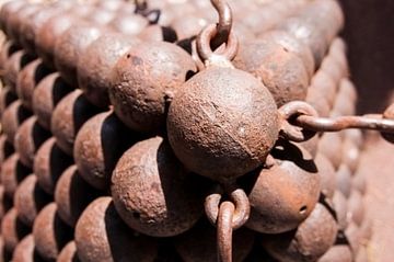 pile of old rusty cannonballs by Anita Hermans