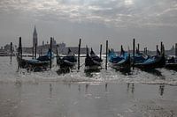 Gondolas in Venice at rising waterlevel