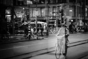 Cyclist in shop window by PIX STREET PHOTOGRAPHY