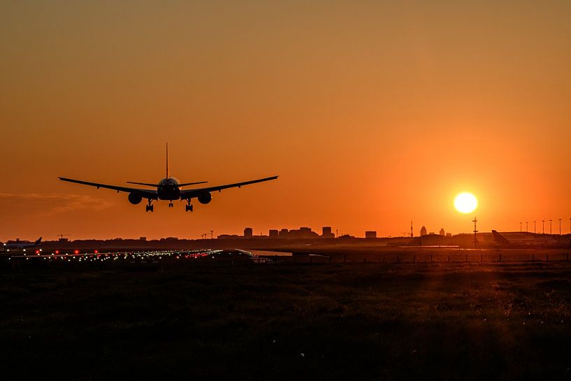 Plane almost landed at Schiphol Airport just after sunrise. by Jaap van den Berg