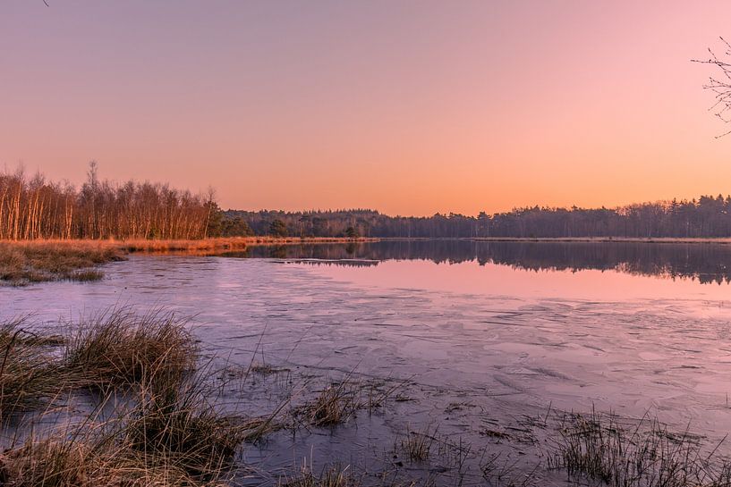 Sunrise at the water's edge with a layer of ice. by Rick van de Kraats