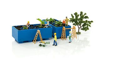 little world figures creating and busy with planting and watering the vegetable garden by ChrisWillemsen