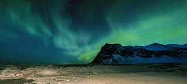 The Northern Lights in Iceland in winter. by Bart Ceuppens