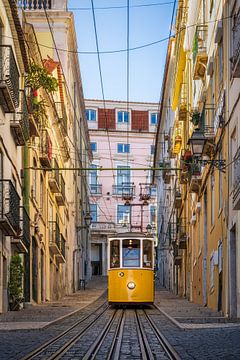 Historic yellow tram in Lisbon, Portugal by Michael Abid