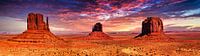 Panorama mesa monoliths in Monument Valley in tah USA with clouds and sunset