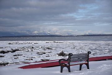 A bench on the dock in winter by Claude Laprise