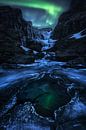 Frozen waterfall on aurora borealis night in Iceland by Daniel Gastager thumbnail