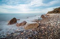 Stones on shore of the Baltic Sea in Elmenhorst, Germany by Rico Ködder thumbnail