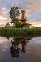 Mill at the lake in the morning light