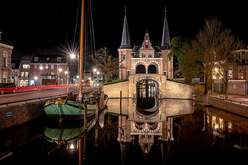 Mirroring Sneker skûtsje and water gate in Sneek city canal