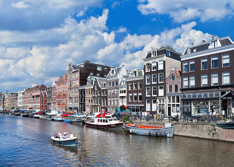 Tourists enjoy a sunny bout-tour in Amsterdam by Tony Vingerhoets