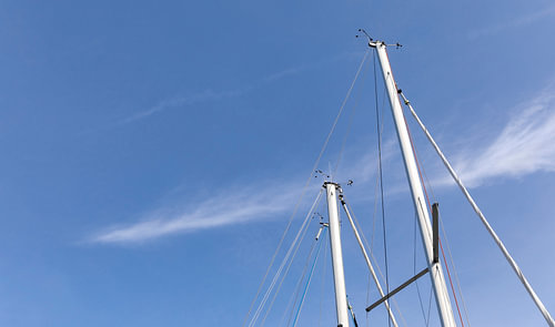 Mast of boats with blue sky