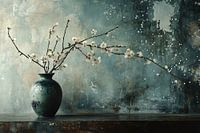 Vase with white blossom branches