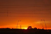 Sunset over the road and railway line