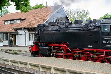 Steam locomotive of the Brockenbahn in the station of the city of Wernigerode in Germany by Heiko Kueverling