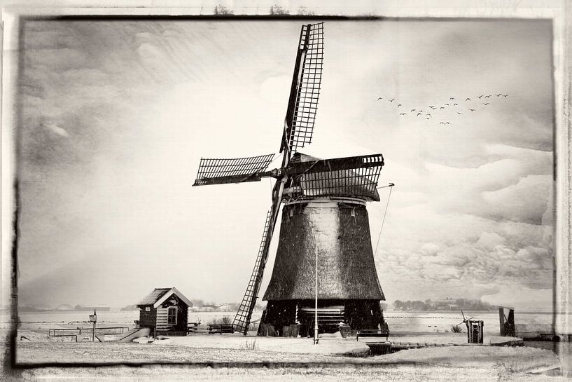 Windmill in a winter landscape by eric van der eijk