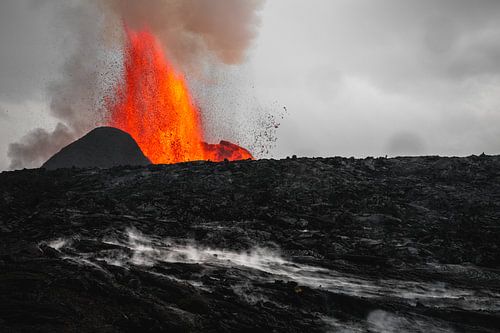 The volcano behind the lava field