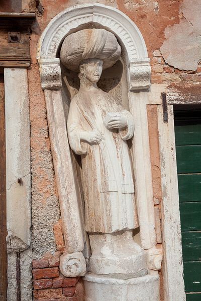 Moor with turban in old town of Venice, Italy by Joost Adriaanse