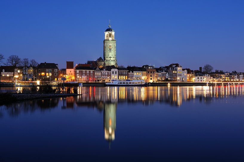 Skyline of Deventer on the river IJssel in the evening by Merijn van der Vliet