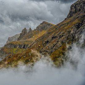 Surrounded by clouds, the mountains of the Dolomites show themselves in all their beauty. by Leon Okkenburg