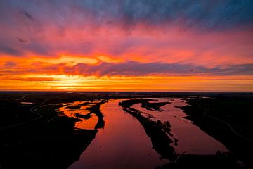 Amazing colorful sunset over the river IJssel
