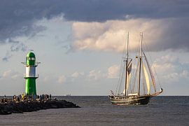 Pier tower and sailing ship on the Baltic Sea during the Hanse Sail by Rico Ködder