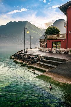 Promenade of Torbole at Lake Garda after the rain in the evening at sunset
