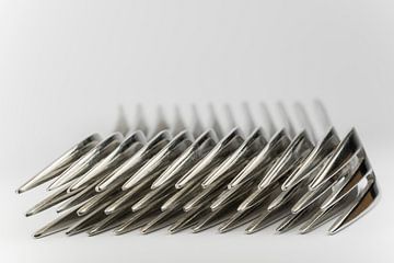Abstracte verzameling van metalen vorken