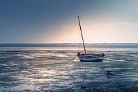 Stranded boat at low tide