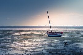 Stranded boat at low tide