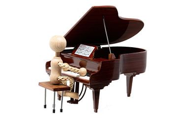 Wooden figure playing mini piano by Hans-Jürgen Janda