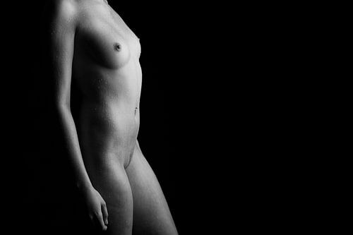 Fully nude woman with water drops in black and white fine art