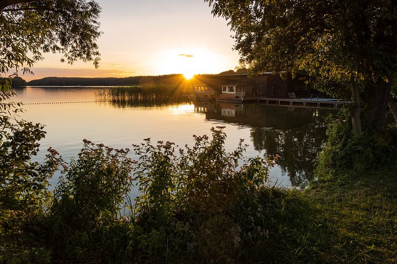 Landscape on a lake with boatshouse by Rico Ködder